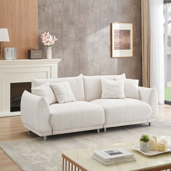 Teddy Wool Beige Sofa With Four Throw Pillows And Hardware Feet Can Sit Comfortably In An Apartment Bedroom Without Taking Up Space